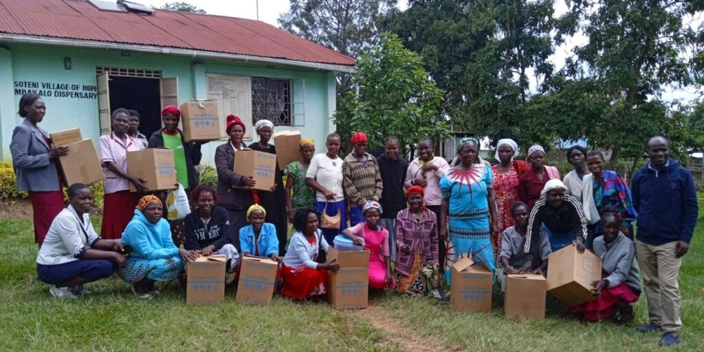 Support group members receiving water filters