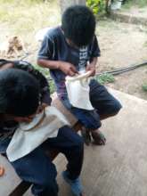 Young children in sewing and embroidery training