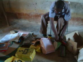 national coordinator keith siame checking books