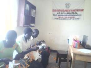 Students learning how to make shopping bags