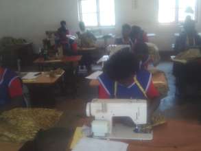 students of tailoring doing an exam