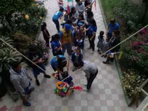 Our children having fun hitting a pinata.