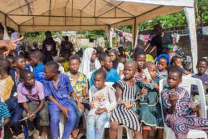Children seated awaiting oral health examination