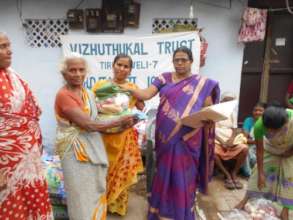 providing Food materials & cloth to a poor women