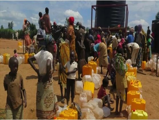 BUILDING RAINWATER TANKS FOR 10 WIDOWS IN KAMONYI