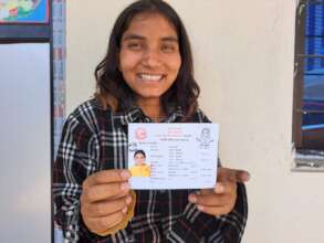 Anu with her recently issued citizenship card