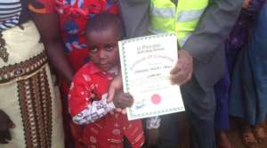 A past talent show event; boy wining certificate