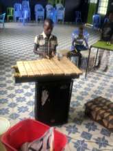 fourth grade pupil playing marimba