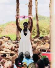 Program director Kevin Okumu teaches Pabbo