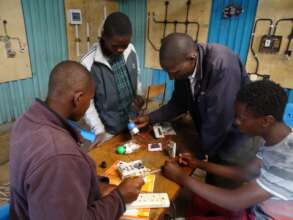 Students being show how electrical circuit is made