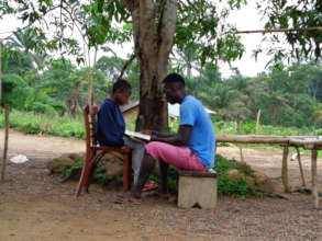 Tutor reading with student after school