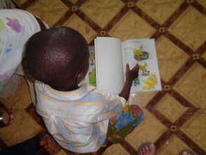 A young boy enjoying a new book