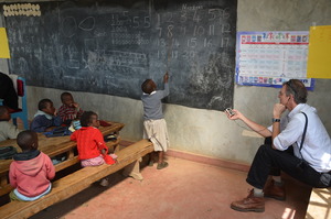 NPR's John Burnet recording at Mahiga Preschool