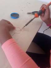 teens learning soldering irons