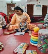 Arko with his mother at the centre