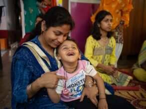 A child learning and enjoying Bhalobasha