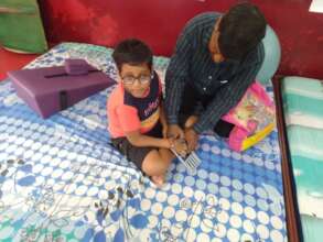Kiaan at school with his support worker
