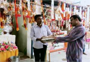 Distributing Paper Bags to the stall owners