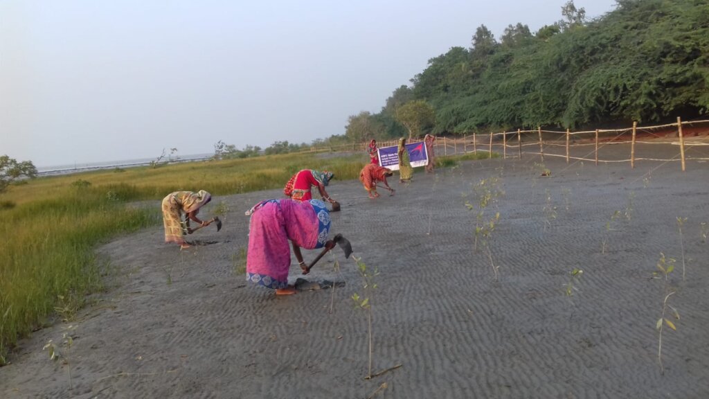 Villagers together at Mangrove Plantation