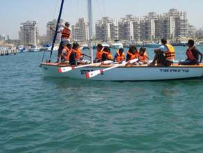Learning team work through water sports