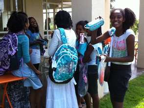 Participants receive new school backpacks/supplies