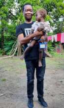 Dr. Lebbie bonding with Grace before treatment