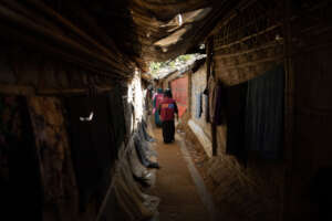 Community health workers walk narrow path