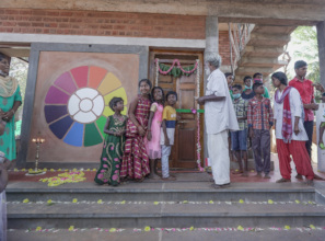 Children cut the ribbon on the new door