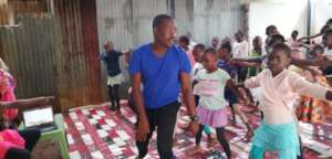 Our founder taking children through dance training