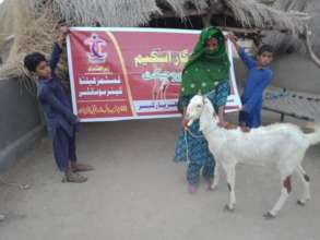 Children are happy to get a Goat