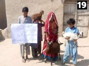 A Widow with her Children Receiving Goat