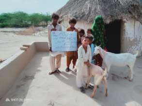 Children are Happy after Receiving Goat