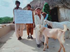 Widow with her Children after receiving Goat