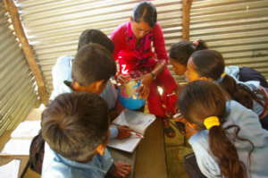 Teacher and students at Gujarpa LSS, Dolakha