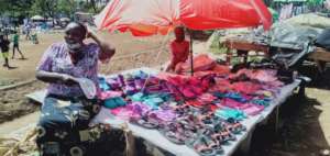 Anna and her granddaughter Grace selling sandals