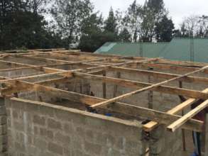 Temporary roof going up