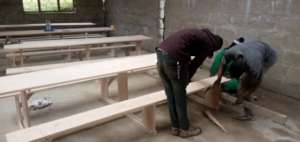 Community members helping with dining tables