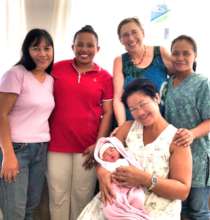Midwife staff with Mother and Baby in new building