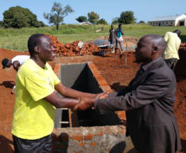 Partners: Patrick (GDPU) and the Gulu DEO