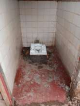 old latrines, cement and walls collapsing