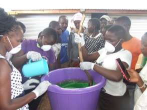Older children helping make liquid soap