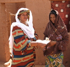 Mentor Tarbane receives letter from RAIN's Rabi (left)