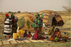 A nomadic Fulani camp with secco mat tents.