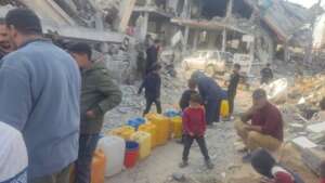 The mobile generator is pumping water for families