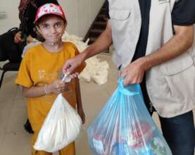 Hala receiving her parcel