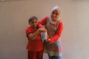 Mena's sisters pose with PKU formula