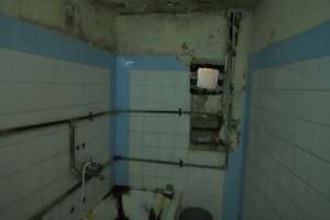 The H famiy bathroom walls in need of fixing