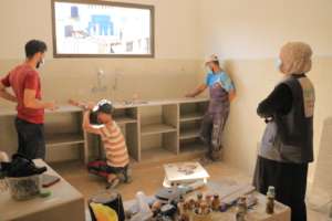 Installing kitchen cabinets and a sink