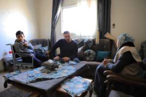 Heba meeting Omar and his dad to assess their need