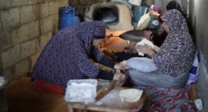 Neighborhood Kitchen, women making bread